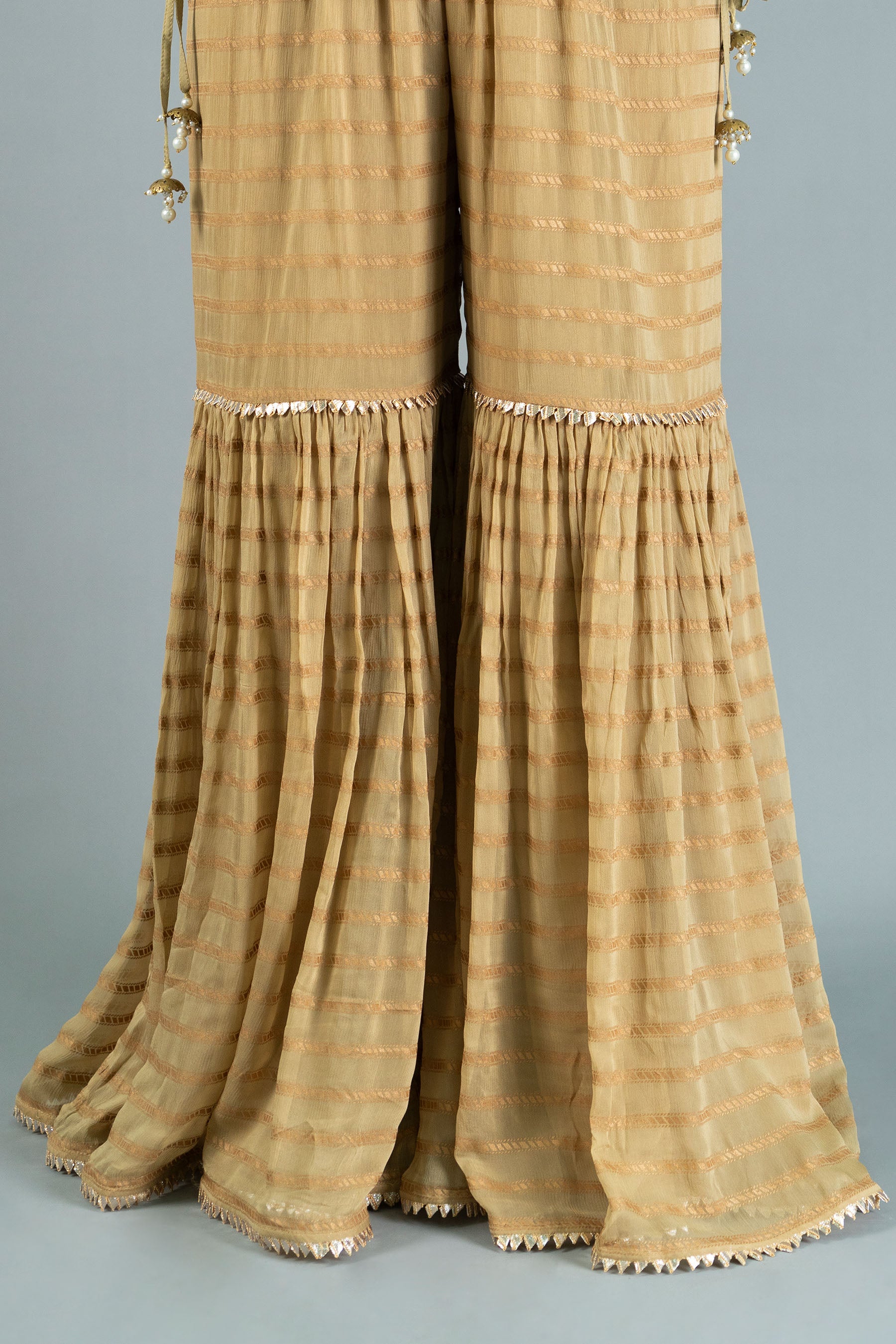 Golden Lines in Beige coloured Pak Chiffon fabric